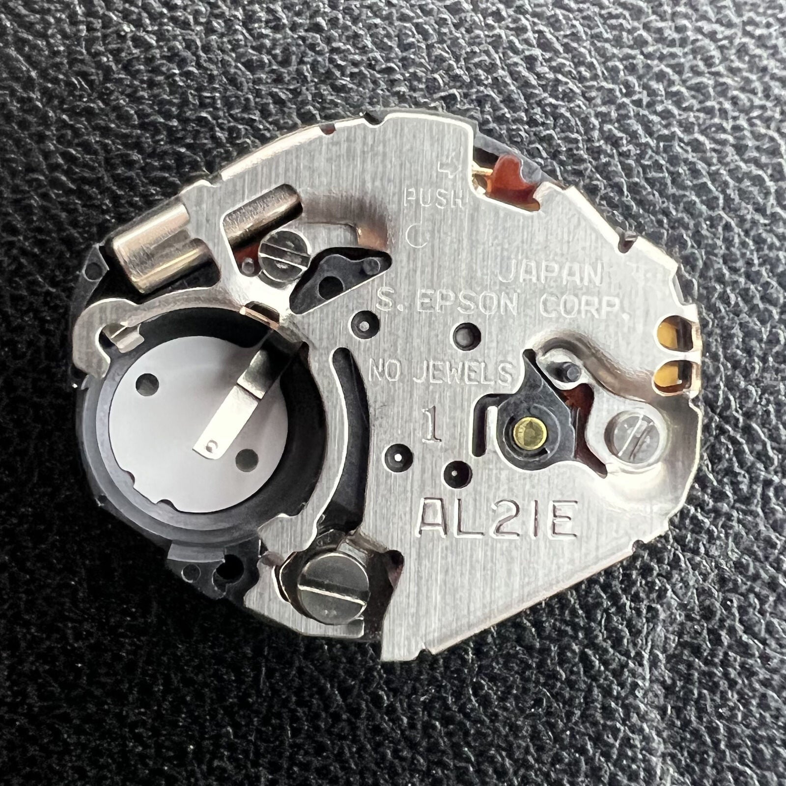 Hattori Epson AL21 quartz watch movement for accurate timekeeping in watch repair accessories.