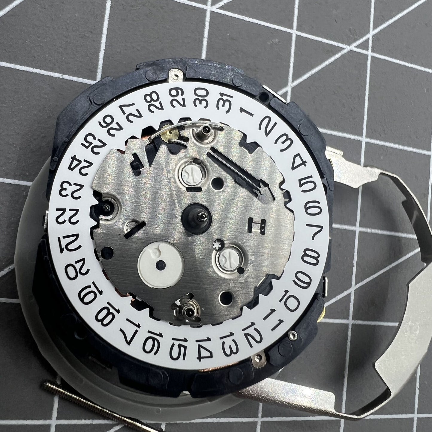 Hattori Epson TMI YM26A quartz watch movement, Japan-made, precise and reliable for watch repairs.