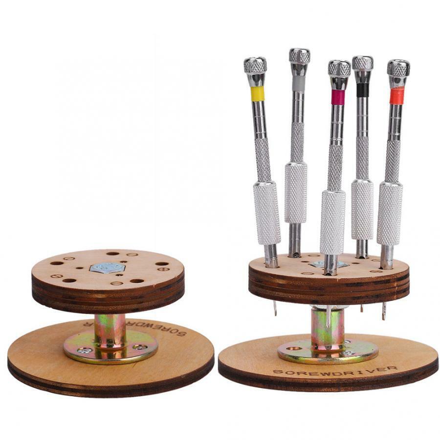 1. Set of 5 steel screwdrivers with rotary stand base for precision watchmaker tasks.