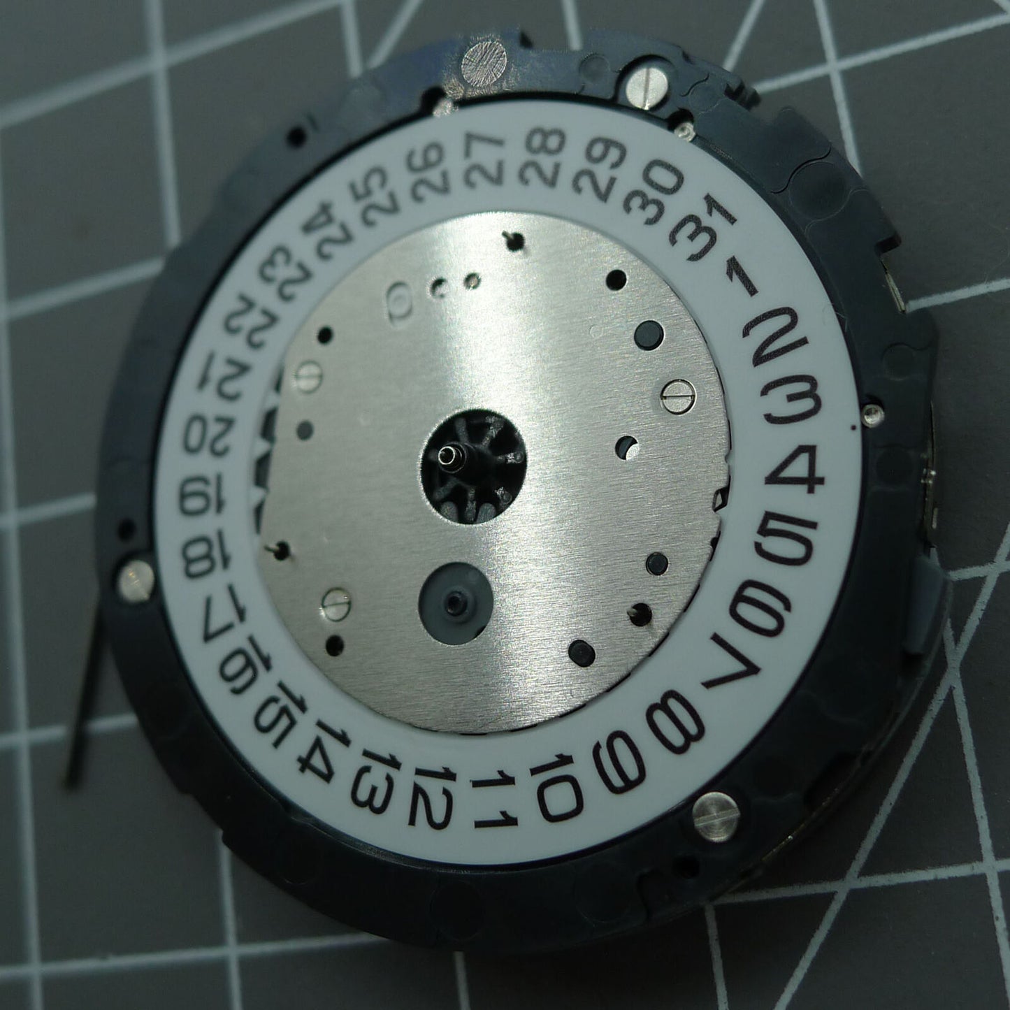 Japan Made Miyota 6S30 quartz watch movement with date at 4 and small seconds subdials.