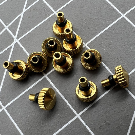 Golden watch crown for Orient watch movement, durable replacement part for precise timekeeping.