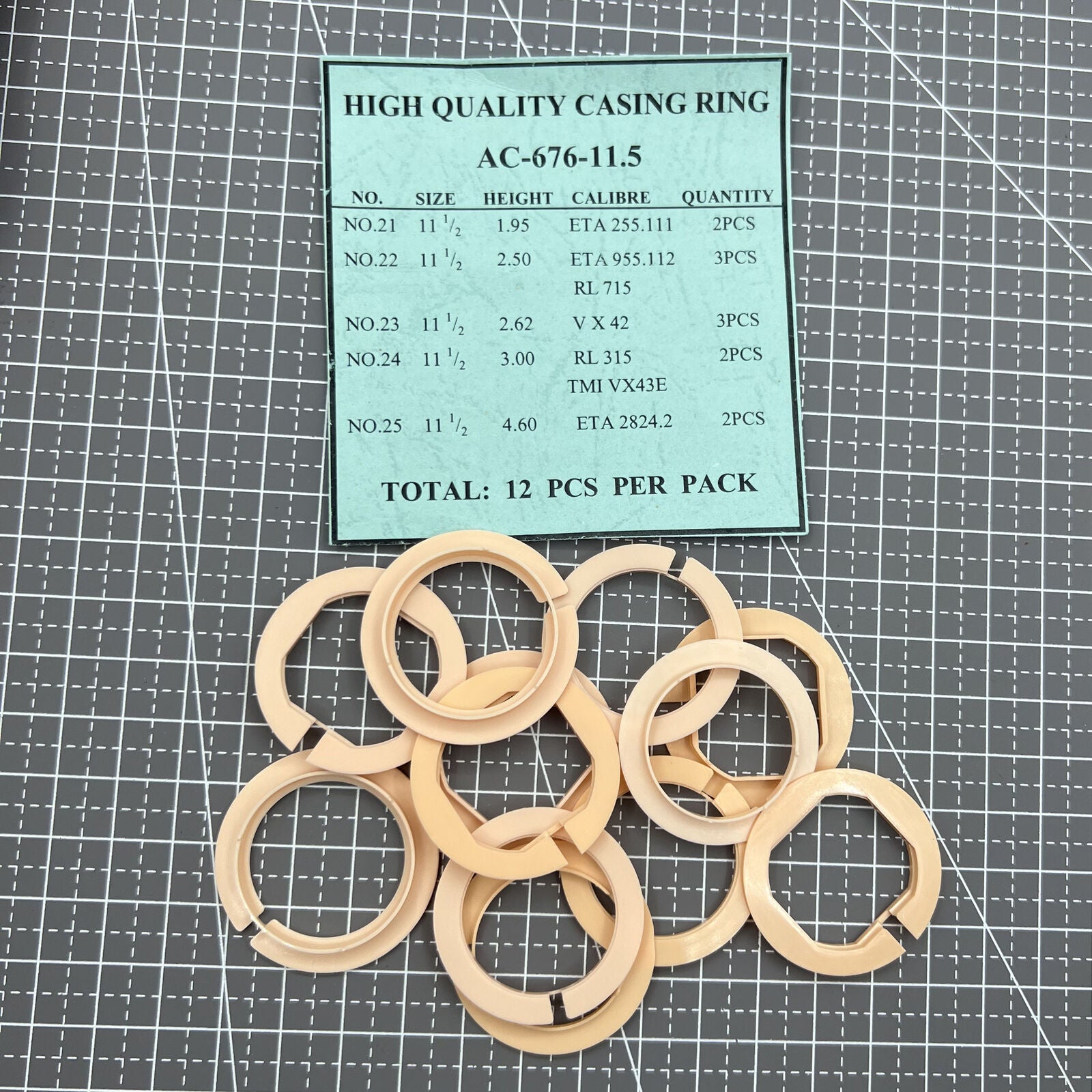 Set of 12 AC-676-11.5 watch movement case spacer rings in 5 sizes for precise watch assembly.