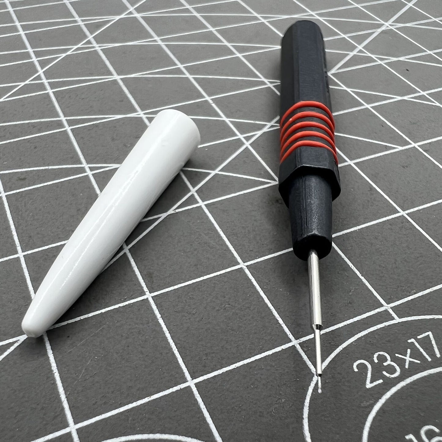 Swiss Bergeon 7013-R red metal dip oiler designed for precise watch grease application by watchmakers.