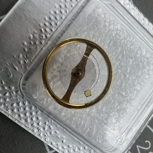 Golden complete balance wheel with hairspring for NH35/NH36/NH38/NH39 movements by Seiko, precise watch part.