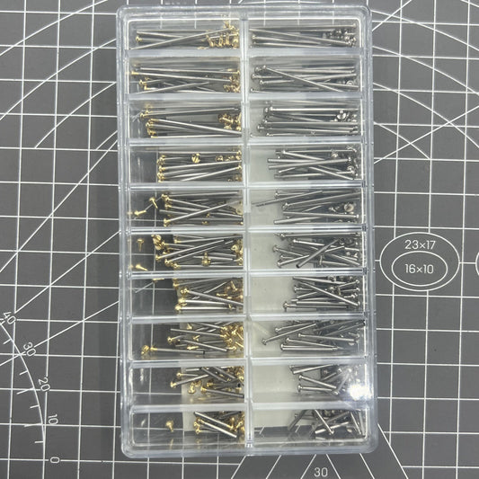 Assortment of watch strap screws, tubes, and friction pins for bracelet repair