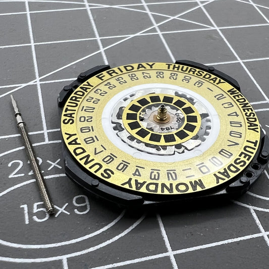 Hattori Epson TMI VX44E quartz watch movement with golden dial and date at 3 o'clock for precise timekeeping