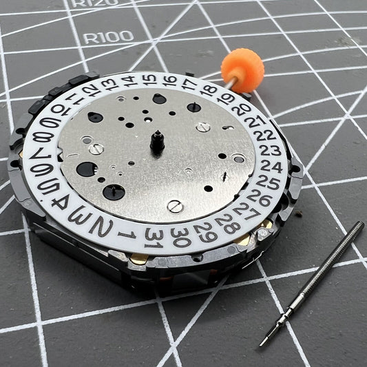 Miyota JS25 Japan quartz watch movement with small seconds at 3, 6, and 9 o'clock, date window at 3, precision timekeeping.