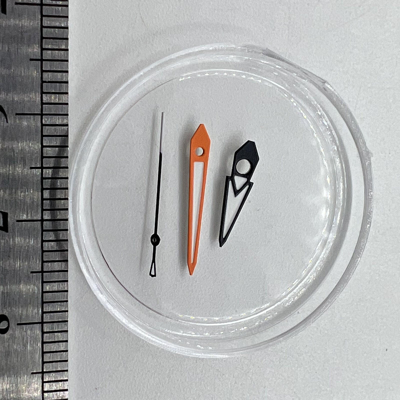 Luminous green watch hands with black and orange trim, white painted for NH35/36 movements.
