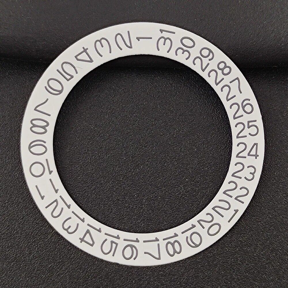 Black and grey date disk overlay for NH35/NH36 watches, enhancing dial clarity and style.