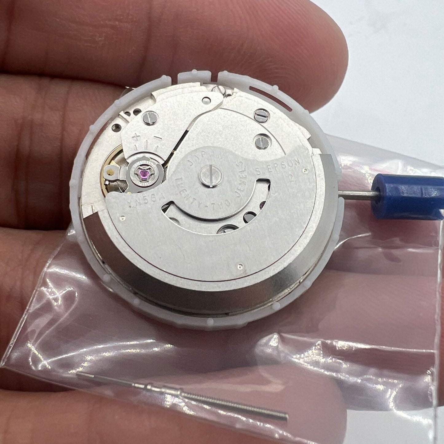 Epson YN56 watch movement with mechanical date and day display, precision-engineered in Japan.