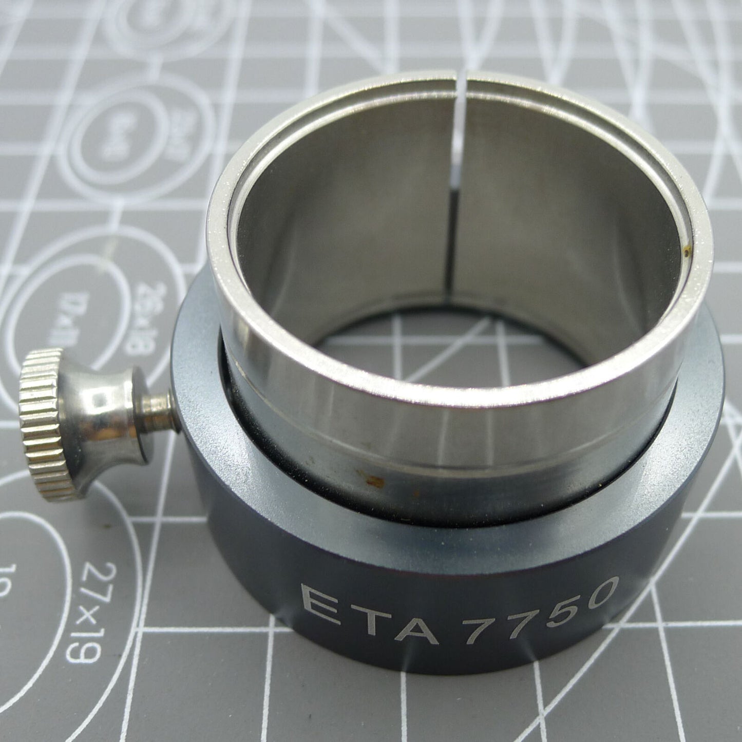 Reversible ETA 7750/7751 movement holder with knob for watch repairs, precision tool.