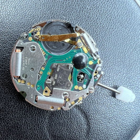 Swiss ISA 8171A quartz watch movement with 4 hands and white date disk at 6 o'clock position, precision timing.