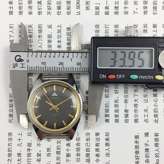32mm Chinese Taihang manual mechanical watch with 17 jewels, black dial, and golden nail markers.