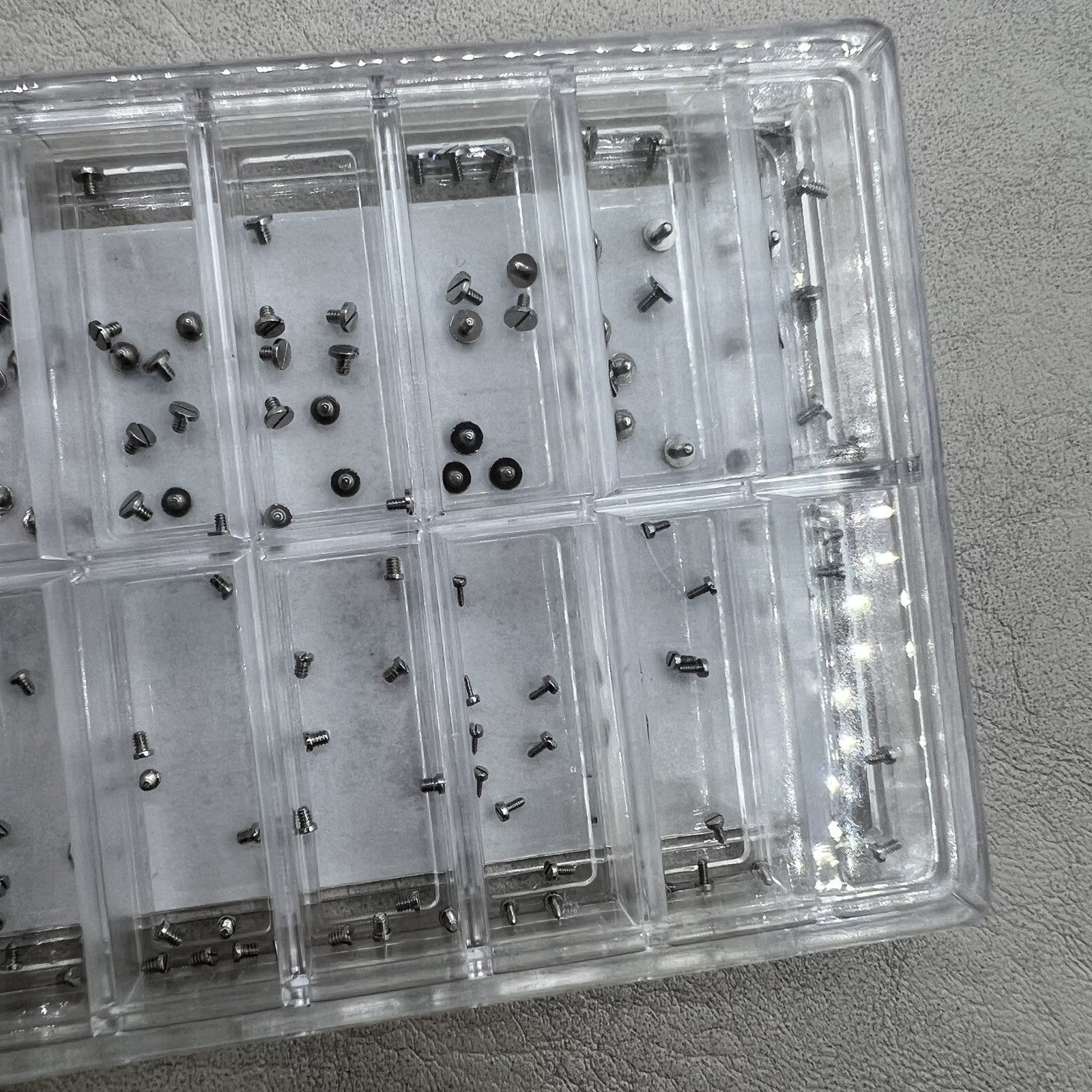 High-end stainless steel mini screws set, straight line head, assorted sizes for watch case backs.