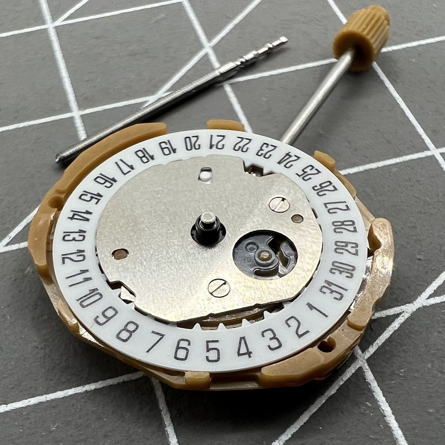 Miyota GL15 Japan Quartz watch movement showing date display at 6 o'clock position