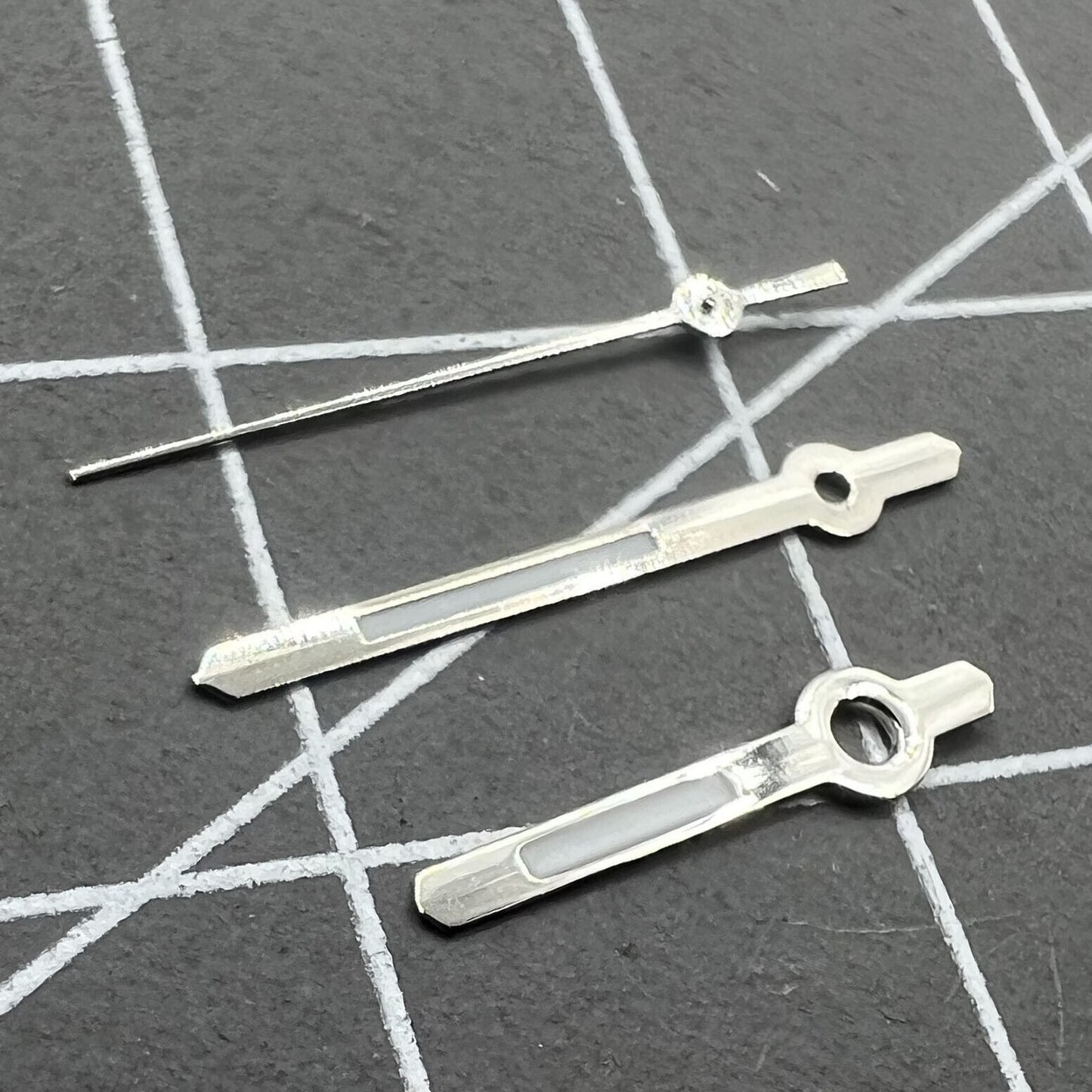 Silver-trimmed 13mm watch hands with green lume for Hattori Epson PC32 quartz movement accessories, enhancing readability and style