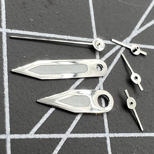 Silver trim green luminous watch hands for Miyota FS00 movement, enhancing readability in low light conditions.