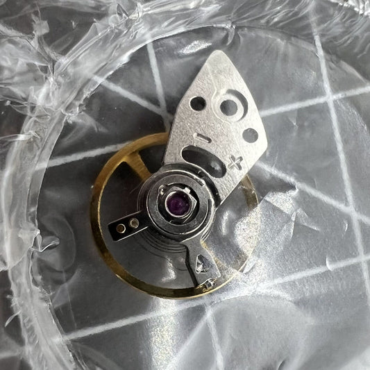 Genuine Miyota 8N24 balance wheel with splint for precise Japan-made watch movement.