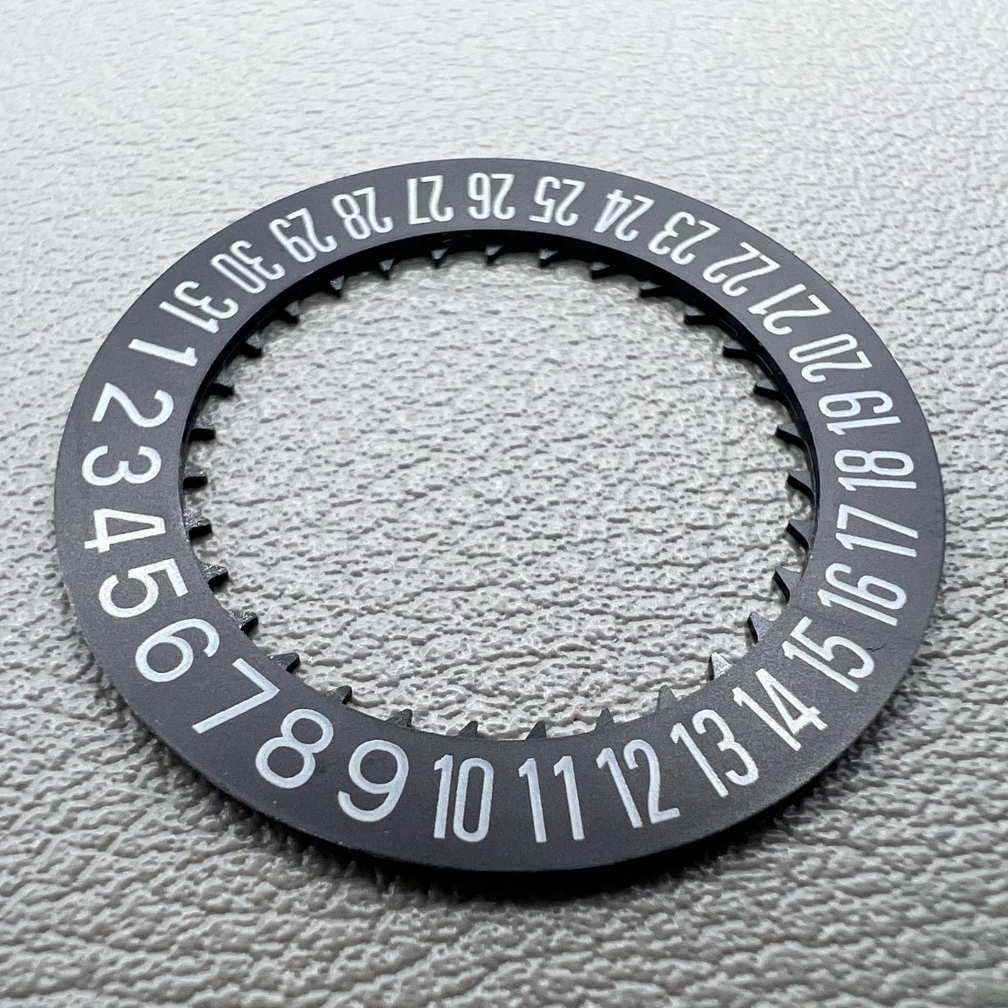 Black date disk wheel showing date at 6 o'clock, compatible with NH34 NH35 movement, precision watch part.