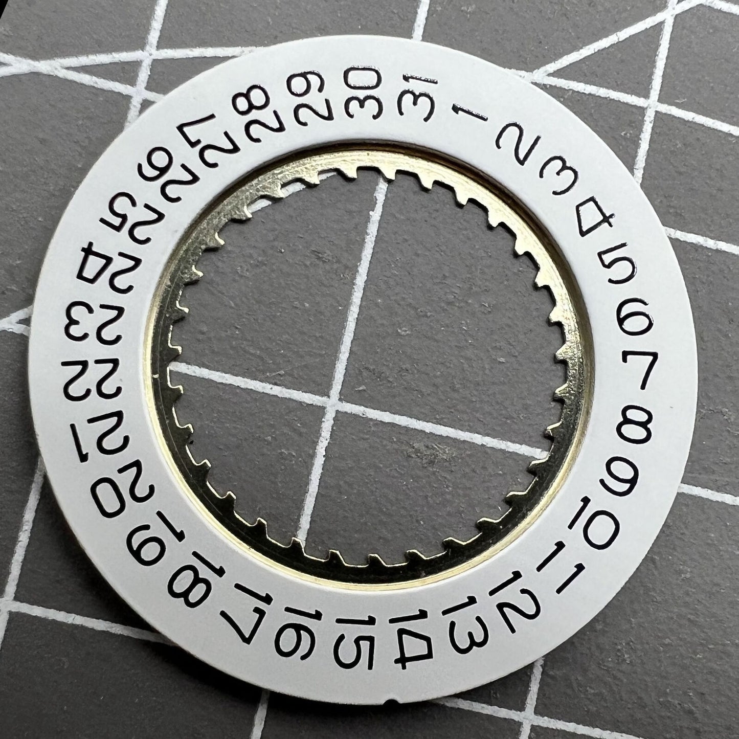 White date disk wheel for Ronda 5040D and 5030D watch movements, date at 4 o'clock position.
