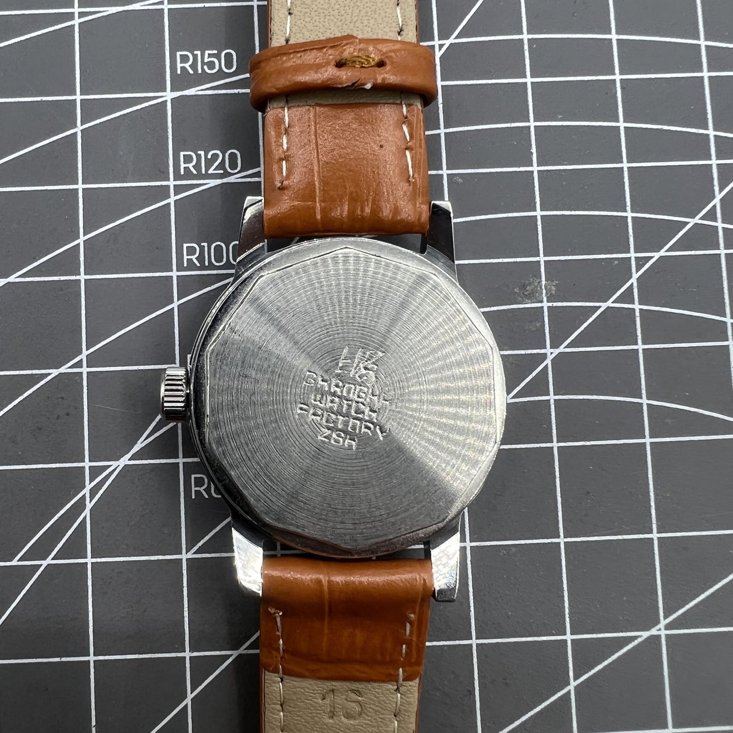 Silver 32mm Shanghai Factory manual watch with silver case, nail markers, and classic mechanical movement