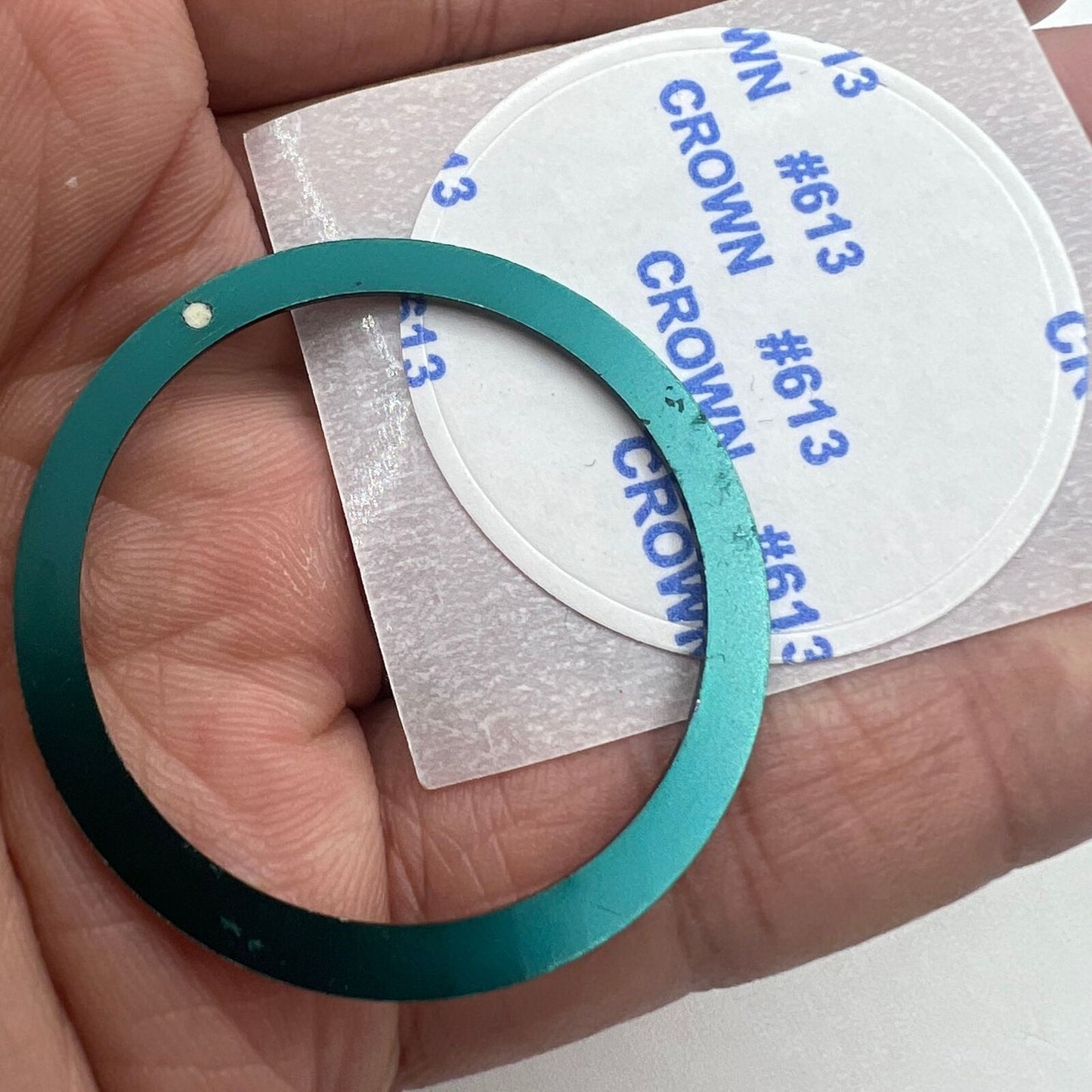 Dark green 39mm aluminum watch bezel insert with white font, circular arc design for precise timekeeping.