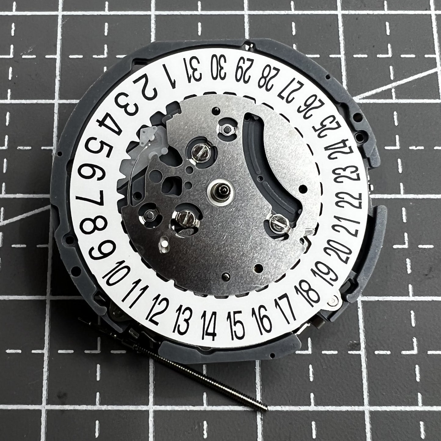 Japan Hattori VK64A quartz watch movement with date display at 6 o'clock, precise timekeeping.