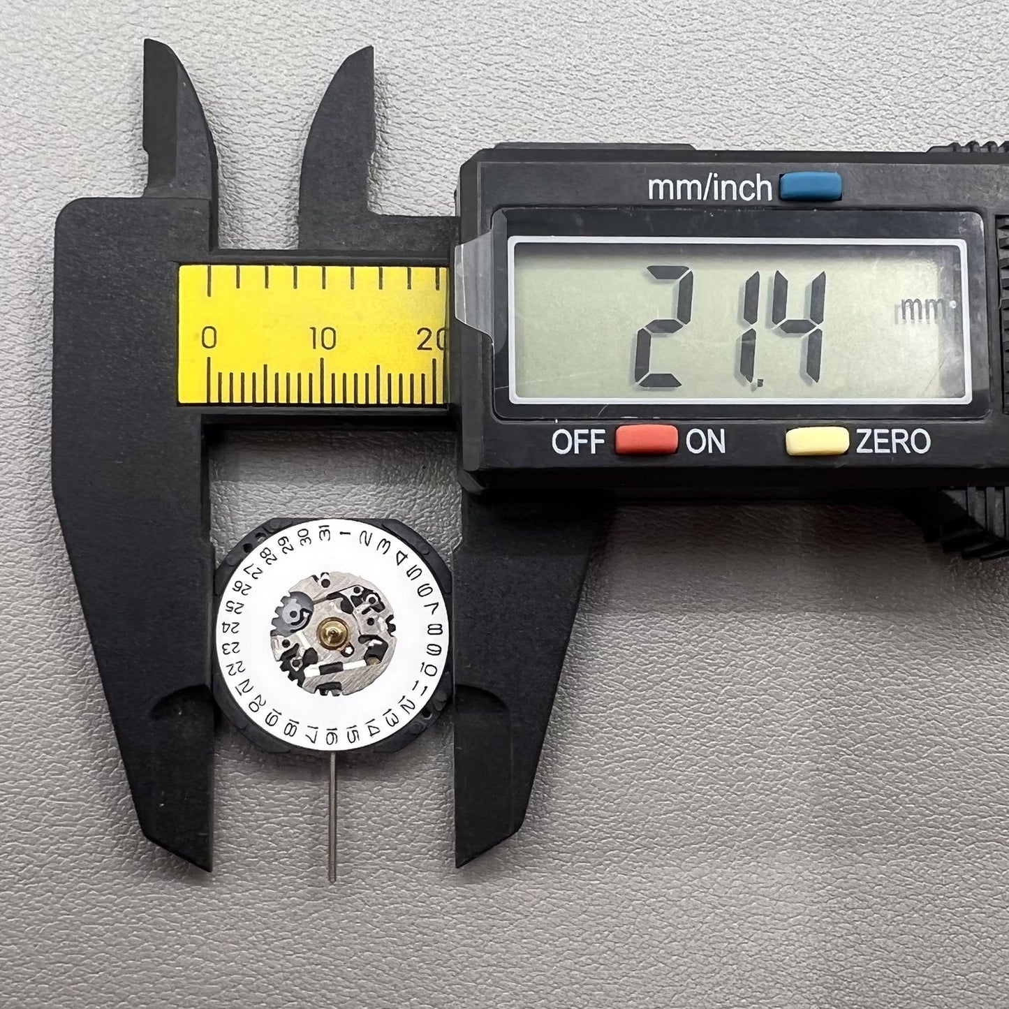 Japan Hattori Epson VX32 quartz watch movement with date display at 3 o'clock, reliable for accurate timekeeping.
