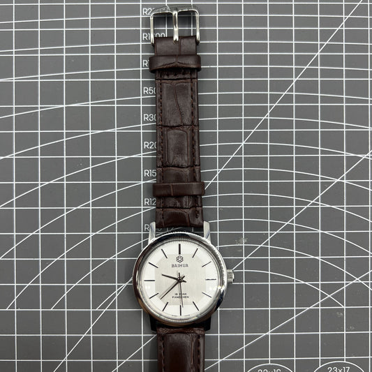 China Baihua 37mm manual mechanical watch with silver dial, 19 jewels, and shock-resistant design.