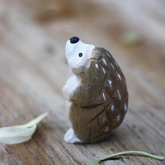 Handmade wooden hedgehog figurine sculpture for home decor, crafted with fine details and natural finish.