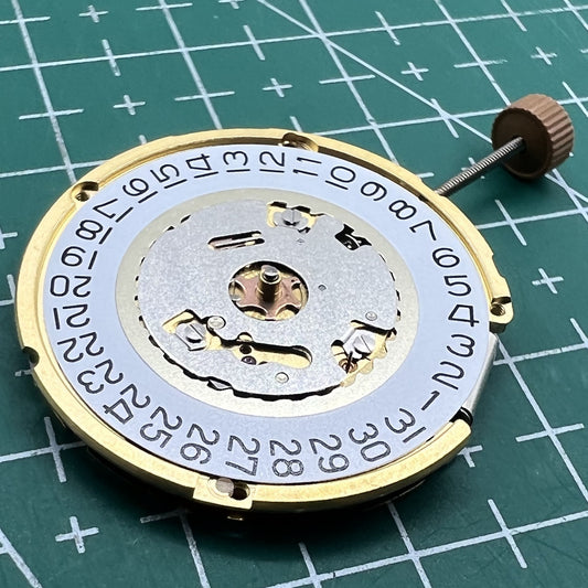 Swiss Made Ronda 6004D quartz watch movement with date display at 3 o'clock for precise timekeeping