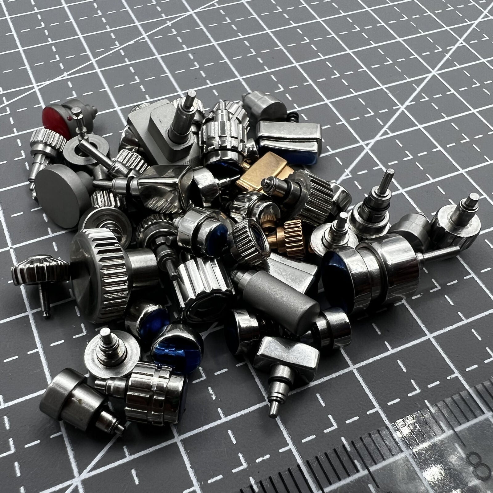 Mixed watch push buttons assortment pack of 50 pieces for watch repair and replacement.