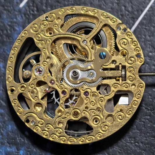 Golden hollow automatic watch part with black rotor, mechanical movement by China Made, for precise timekeeping.