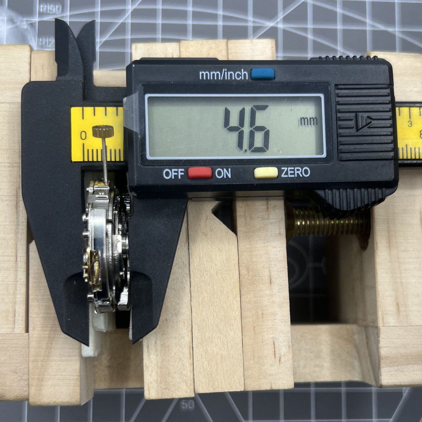 Automatic multifunctional watch featuring mechanical movement, date at 12 o'clock, and visible bare wheel at 6 o'clock.