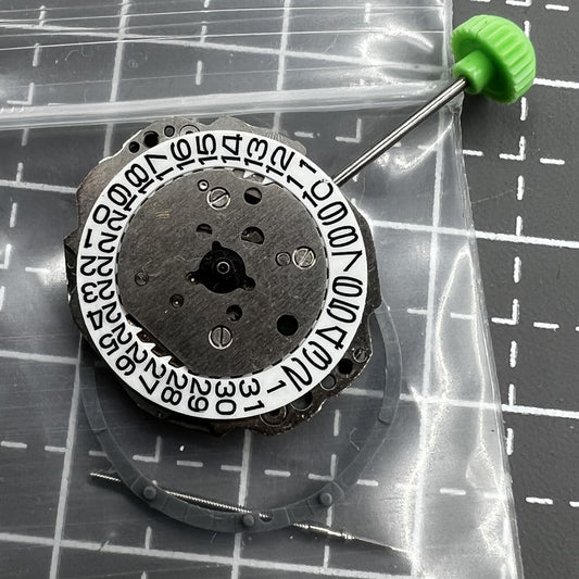 Miyota 4T13 quartz watch movement with 3 hands and single calendar date at 3 o'clock, precision timekeeping.