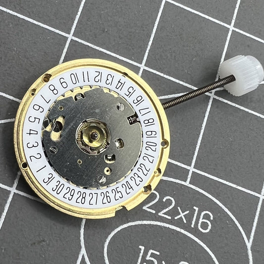 ETA E61.111 watch quartz movement showing three hands and date at 6, precision by ETA.