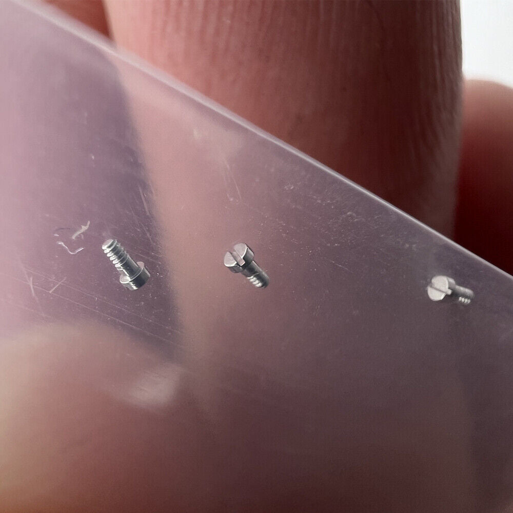 Set of 3 RLX 3135 hairspring bridle screws for accurate Rolex watch movement repair and maintenance.