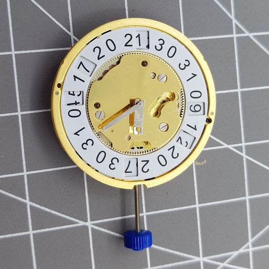 Swiss Made Ronda 5040B Quartz watch movement with golden finish, precise and durable for luxury watch repairs.