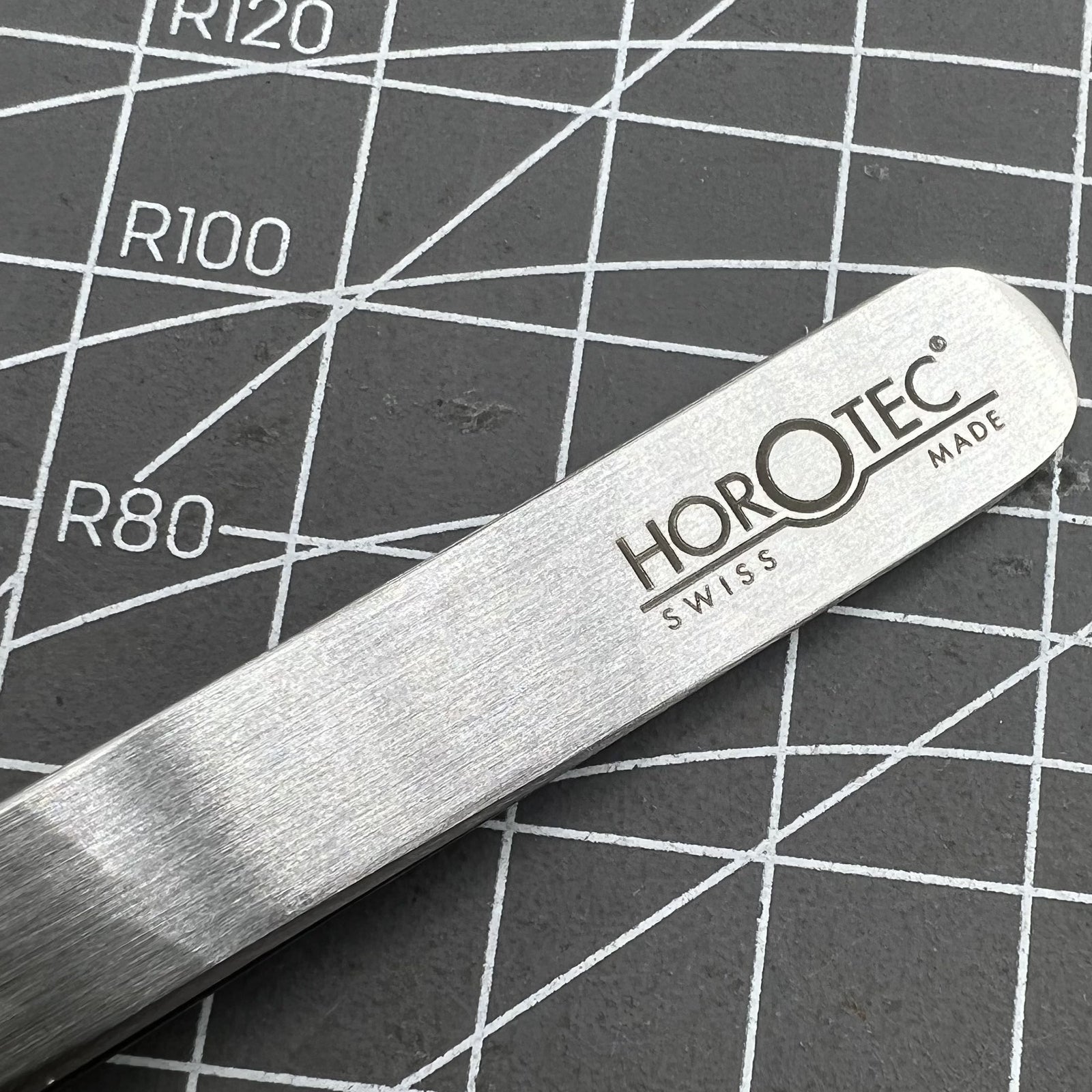 Swiss Horotec antimagnetic fine tweezers designed for precise hairspring handling in watchmaking repairs.