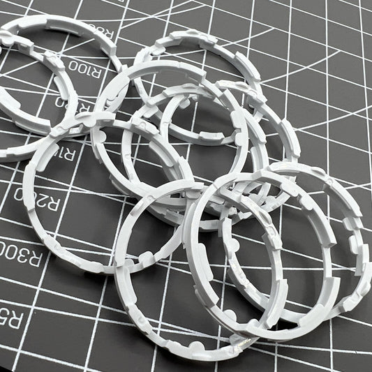 1. Set of 5 Miyota 8200 series movement cushion mount spacer rings for secure watch assembly.