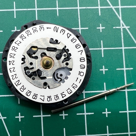 Hattori Epson TMI VX12E quartz watch movement with date display at 3 o'clock for precise timekeeping.