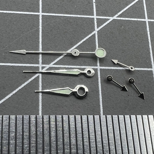 Silver trim green luminous pointed watch hands for Miyota OS series, enhancing visibility and style.