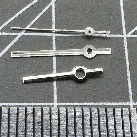 Silver watch hands set for Miyota 2035 quartz movement, sleek design by P1-H2-C18 for precise timekeeping.