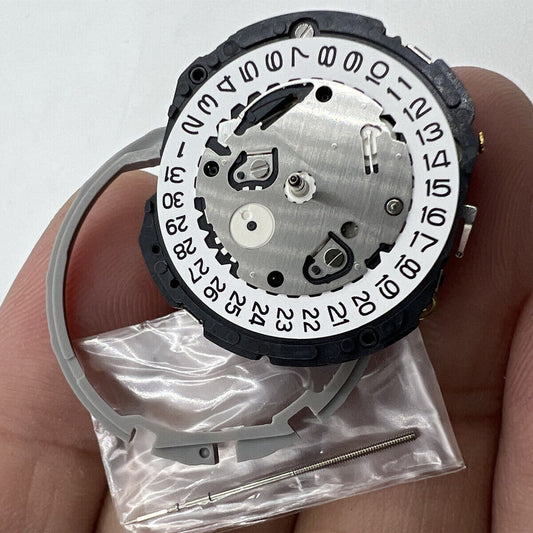 Hattori Epson TMI YM1G quartz watch movement with date display at 3 o'clock, Japan made.