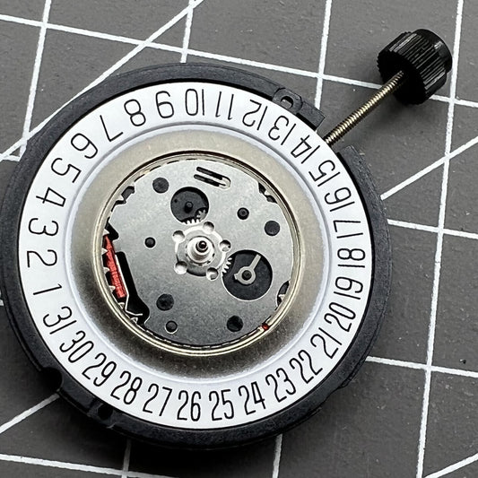 ETA 805.112 Swiss quartz watch movement with 3 hands and date at 6 o'clock, precision craftsmanship.