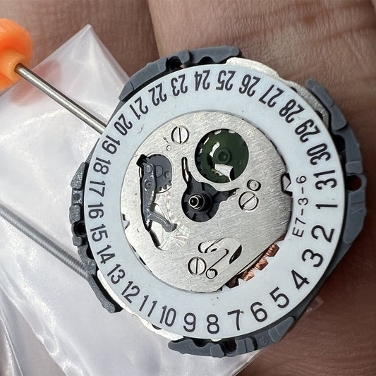 Miyota 1N12 Japan quartz watch movement with date display at 3/6, precise replacement part.