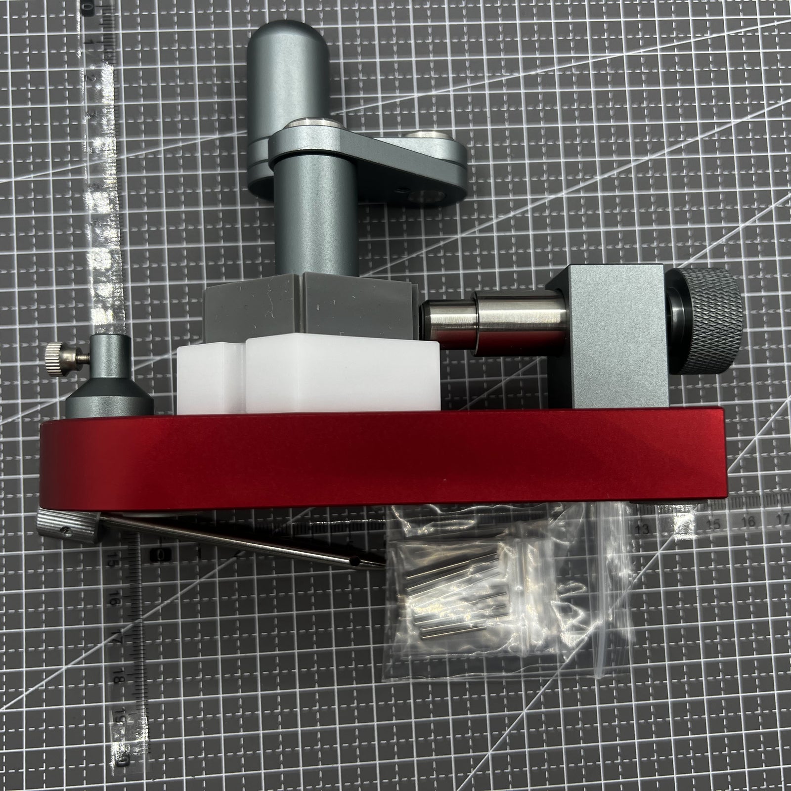 Red swivel tool for removing watch band screw pins, fits 0.6-1.6mm links efficiently.