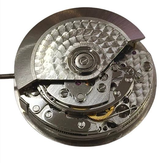 Close-up of China Made Dandong 7750 mechanical watch movement featuring small seconds at 3, 6, and 9 o'clock positions.