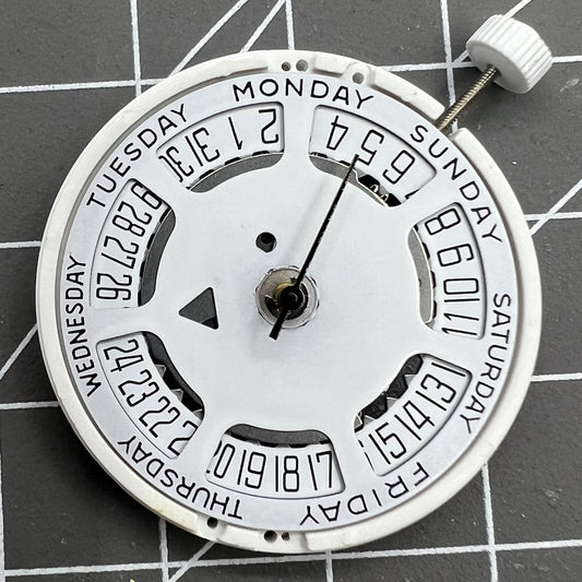 ISA 1198 quartz watch movement with day-date function and white dial, date at 6 o'clock, replacement part.