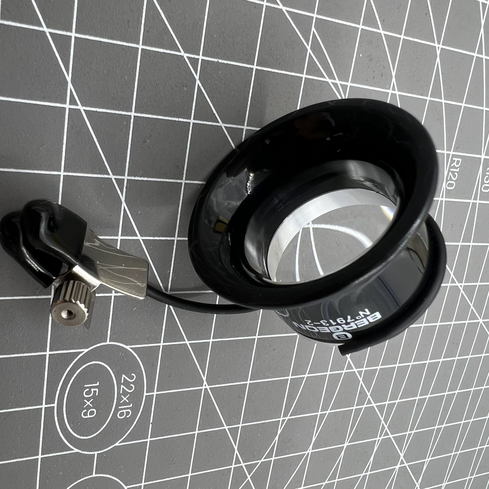 Swiss Bergeon watchmaker eyeglass with clip, magnification X3.3-X5, perfect for detailed watch repair tasks.